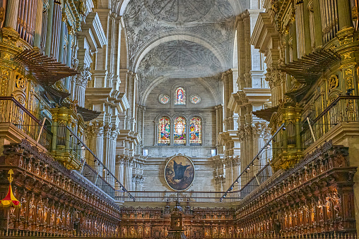 Malaga, Spain - July 30, 2022:   View of the arthex of he Malaga Cathedral (or Santa Iglesia Catedral Basílica de la Encarnación) with the wooden choir in the foreground