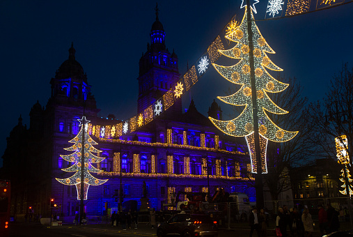 Traditional old gothic building with christmas ligthing decoration at george plaza of glasgow Scotland England