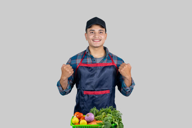 young male asian muscular farmer shows several gestures and expressions along with vegetable harvest - 11084 stock-fotos und bilder