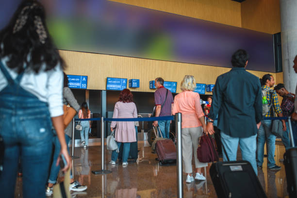 istock People Waiting For A Check In At The Airport 1930025667