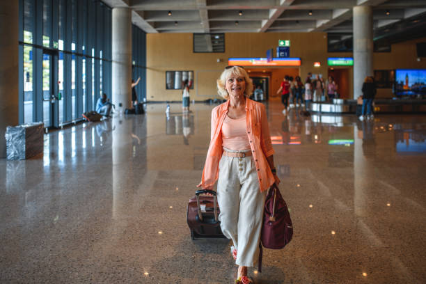 istock Attractive White Senior Female Traveling Alone 1930036278