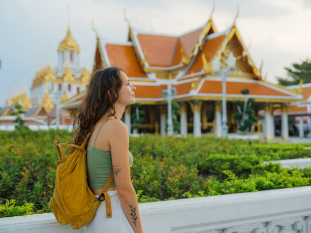 istock Woman exploring temple in Bangkok during her vacation 1930037180