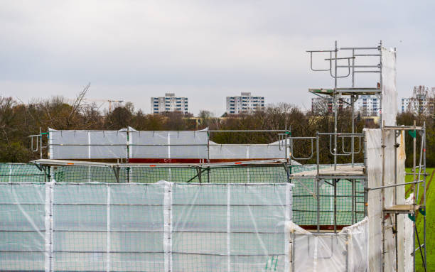 istock Metal scaffolding on cityscape background 1930045319