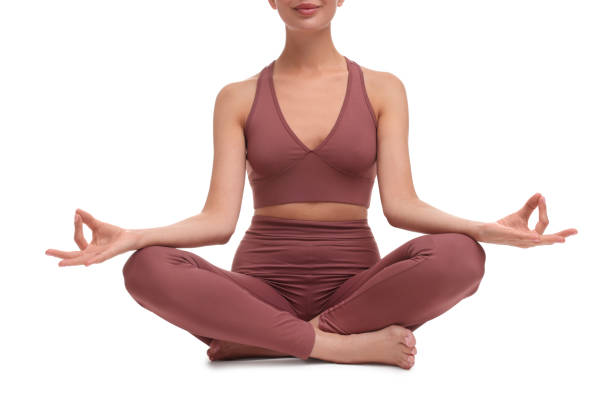 istock Woman practicing yoga on white background, closeup. Lotus pose 1930048012