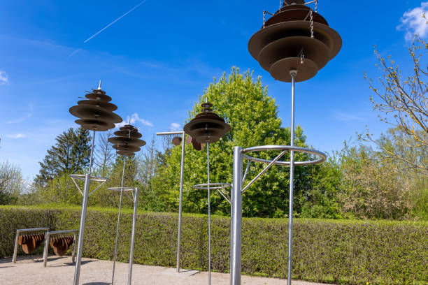istock Wind chimes in the park against the blue sky with white clouds 1930050127