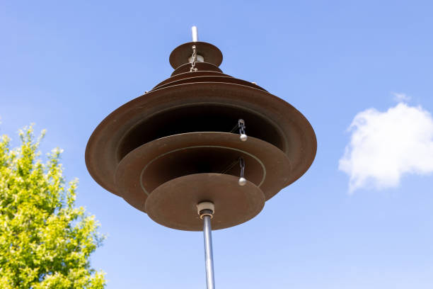 istock Wind chimes in the park against the blue sky with white clouds 1930050135