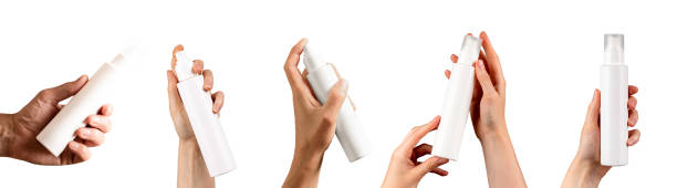 Plastic spray bottle, blank cosmetic package, dispenser in hand set, isolated on white