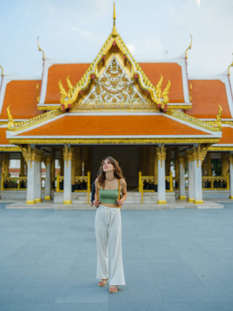 istock Woman exploring temple in Bangkok during her vacation 1930063295