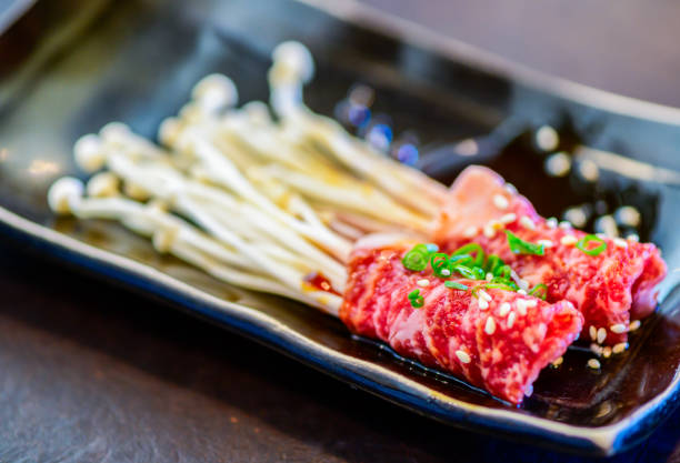 Enoki wagyu beef rolls on dish, Premium Japanese meat concept