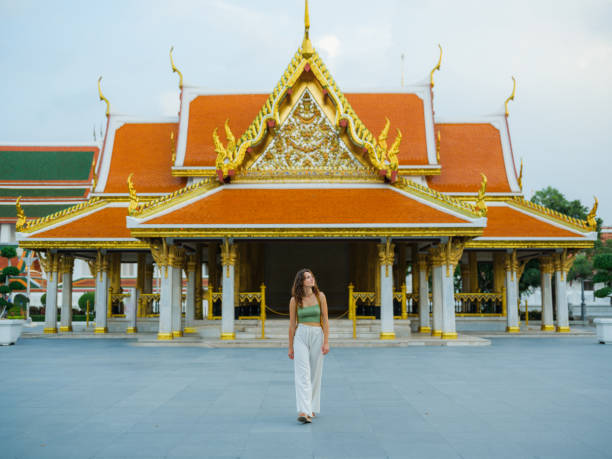 istock Woman exploring temple in Bangkok during her vacation 1930080697