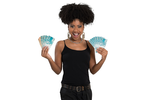 girl holding money Brazilheiro, smiling afro-brazilian girl holds money with both hands on white background