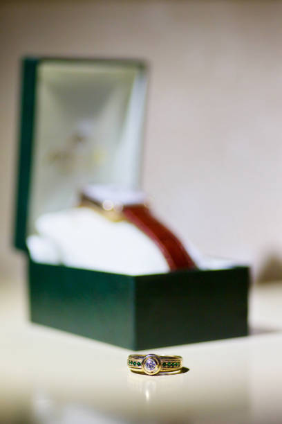 istock Wedding rings for weddings lie on a mirror reflecting surface. 1930108432