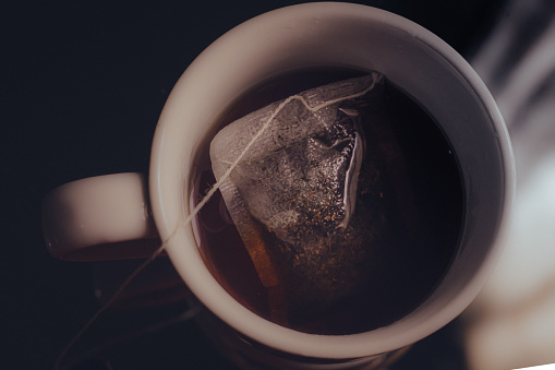close up of a teabag in a cup of tea