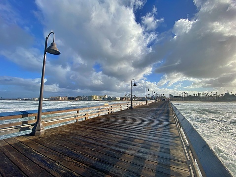 The fishing pier at Imperial Beach, near San Diego, offers beautiful views of birds, ocean, and crashing surf.