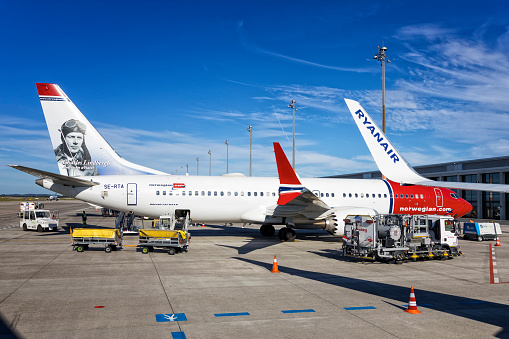 The Norwegian.com plane Boeing 737-max, few minutes before the departure, is parked in the Berlin Brandenburg, Germany