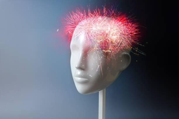Fireworks in a neutral mannequin head, concept for ideas, inspiration and creative connections but also for neurology, headache, migraine or mental problems and ADHD, dark gray background, copy space