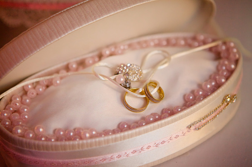 Wedding rings in a beautiful design. The concept of a wedding or engagement