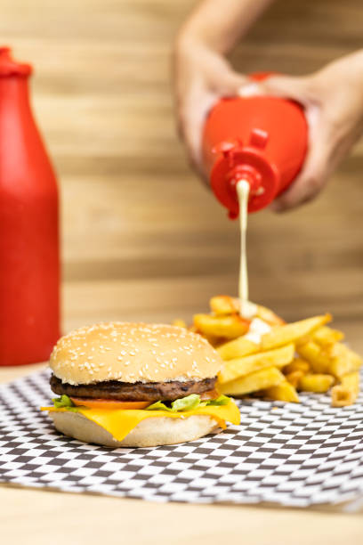 istock sauce for fries and a cheeseburger. studio photo for menu 1930181006