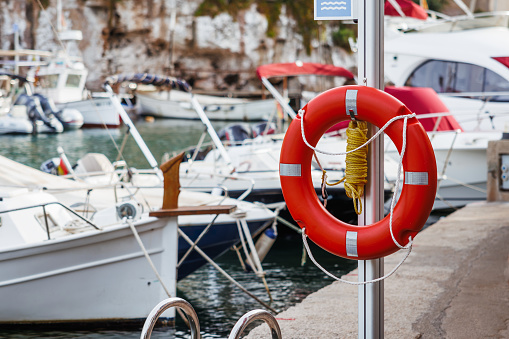 Lifebuoy in Port de Cala Figuera, Mallorca, Spain. Fishing village with boats in Balearic Islands