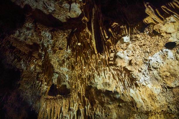 istock A wild cave inside. Stalactites and stalagmites. Speleology and surveys 1930247491