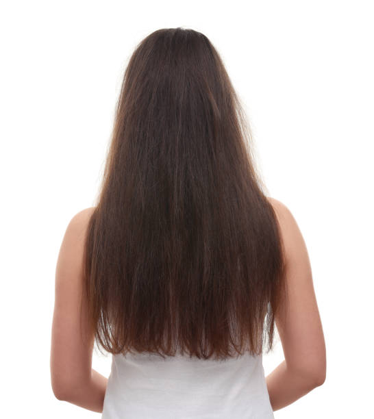 istock Woman with damaged hair before treatment isolated on white, back view 1930257512