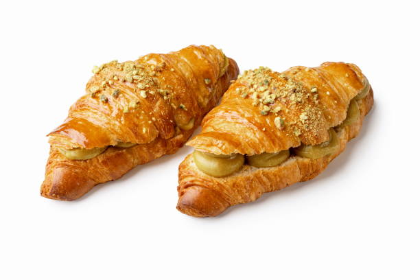 istock Two pistachio cream croissants on white background 1930271533