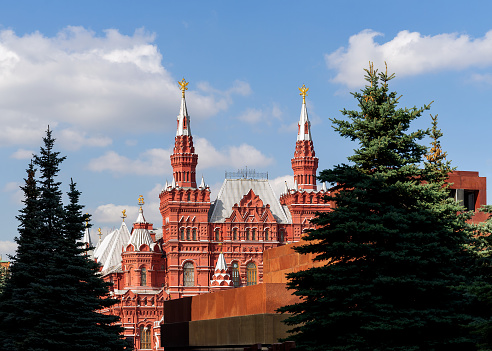 14.09.2023, Russia, Moscow, Red Square, Moscow Kremlin. View of the State Historical Museum from the columbarium in the Kremlin Wall. A fragment of the Lenin Mausoleum is visible in the foreground.
