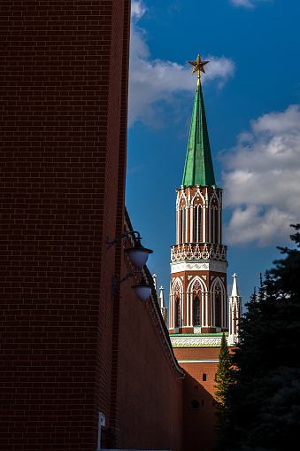 14.09.2023, Russia, Moscow, Red Square, Moscow Kremlin. The Nikolskaya Tower of the Moscow Kremlin is photographed against the blue sky. View from the mausoleum of V.I. Lenin.
