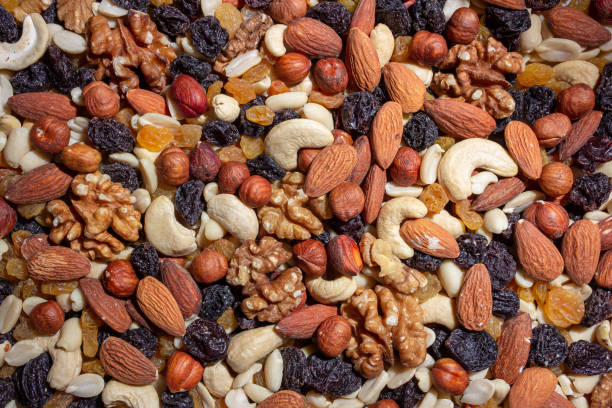 istock Mixed Nuts: Almonds, Walnuts, Cashews, Peanuts, Hazelnuts, Dried Prunes and Raisins 1930280861