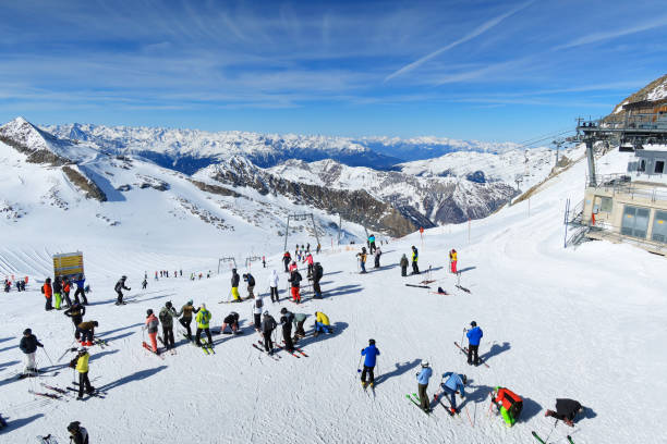Gondola station on the glacier in Hintertux - Austria. There is skiing on the Hintertux Glacier all year round, 365 days a year. The skiers enjoy the beautiful weather in the sunshine.