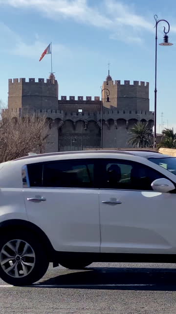 Traffic next to the Torres de Serranos in the city of Valencia, Spain