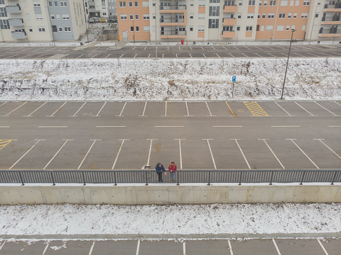 Heterosexual couple having fun time outdoors in the city on cold winter day