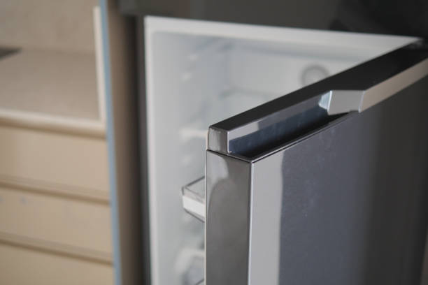 istock half open fridge with food and vegetables , 1930379032