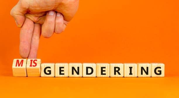istock Gendering or misgendering symbol. Concept words Gendering Misgendering on wooden blocks. Beautiful orange table orange background. Psychologist hand. Gendering or misgendering concept. Copy space. 1930386866