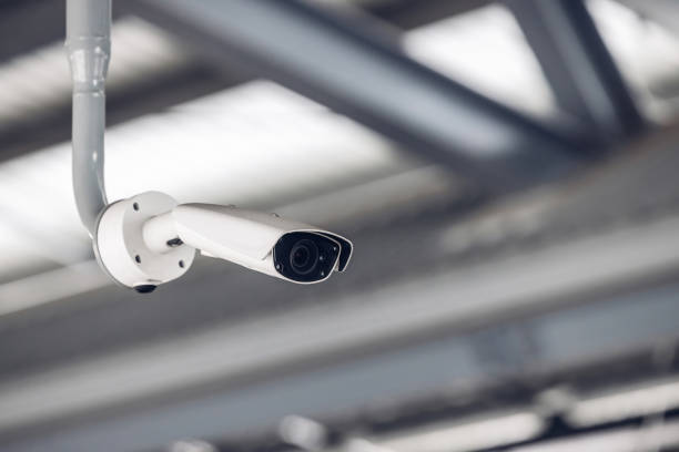 istock Online Security CCTV camera surveillance system outdoor of house. 1930397360