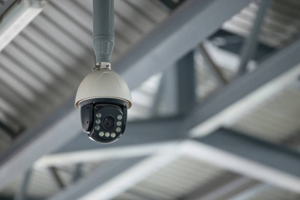 istock Online Security CCTV camera surveillance system outdoor of house. 1930397366