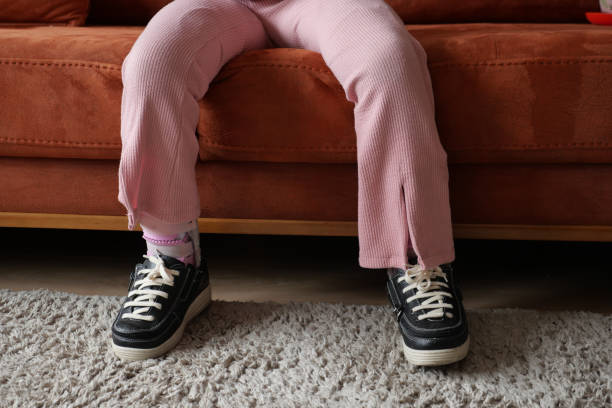 istock Child cerebral palsy disability, legs orthosis. 1930410396