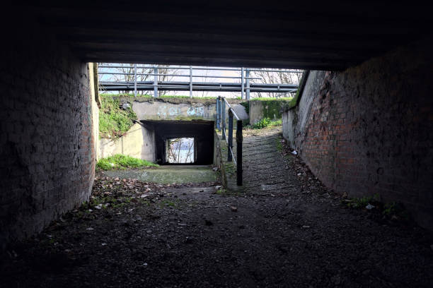 istock Narrow and dirty underpass on a road 1930444037