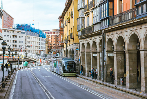 Bilbao, Spain - January 2, 2024: A tram car along the streets in Bilbao, Spain