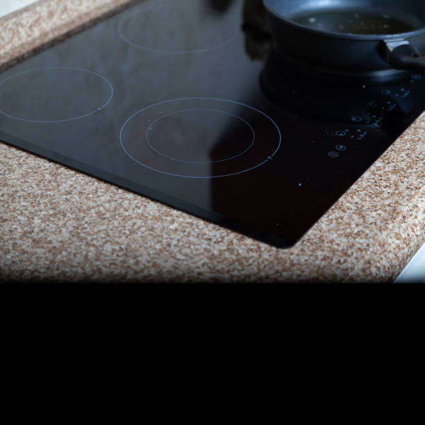 istock Modern built-in electric stove on marble countertop 1930469926