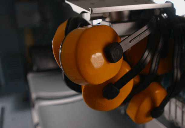 istock Yellow ear protection hanging in the helicopter cockpit 1930537291