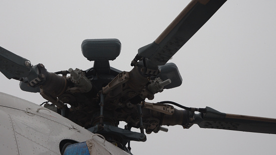 Close-up of a helicopter main rotor part of the body