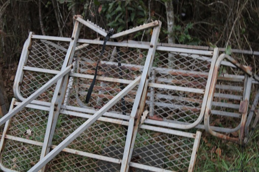 Industrial, Metal Cage Laying On The Ground