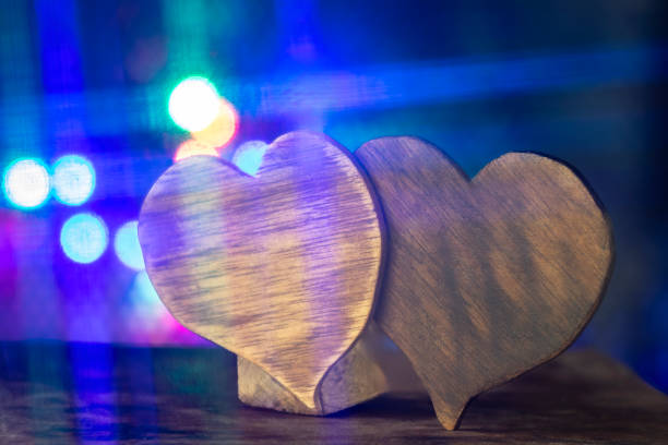 Heart on wood light abstract background