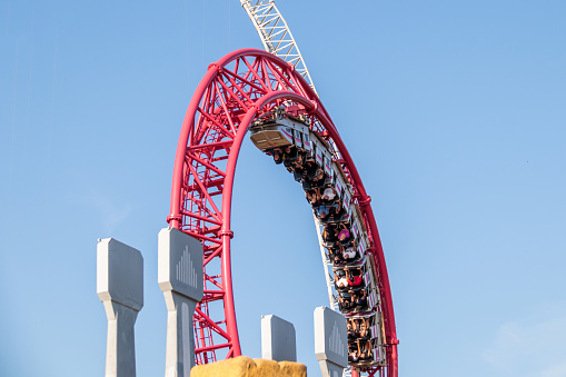 Red roller coaster and big blue sky
