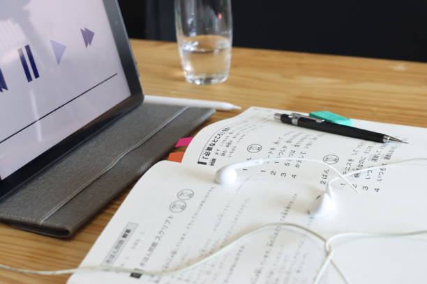 Japonese language Listening homework above a table with an tablet and earphone