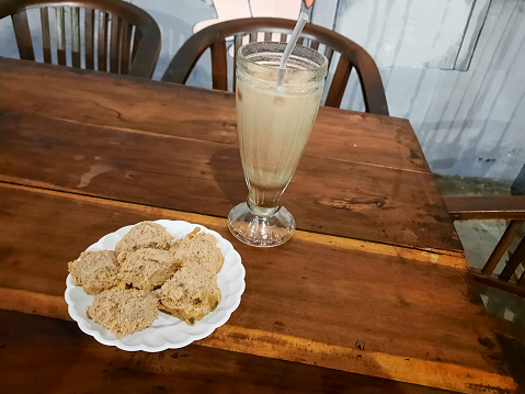 Gorengan Tahu Walik Or Fried Tofu On A Plate. Tahu Goreng Traditional Food. Coffee Iced Drink In Glass. Snack And Drink Menu.