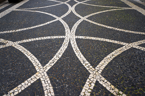 Geometric Pattern in Traditional Mosaic Paving Tiles in Lisbon, Portugal. Diminishing Perspective View.