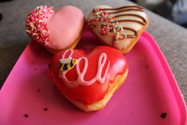 istock Valentines Krispy Cream Donuts Displayed On A Pink Plate 1930645105