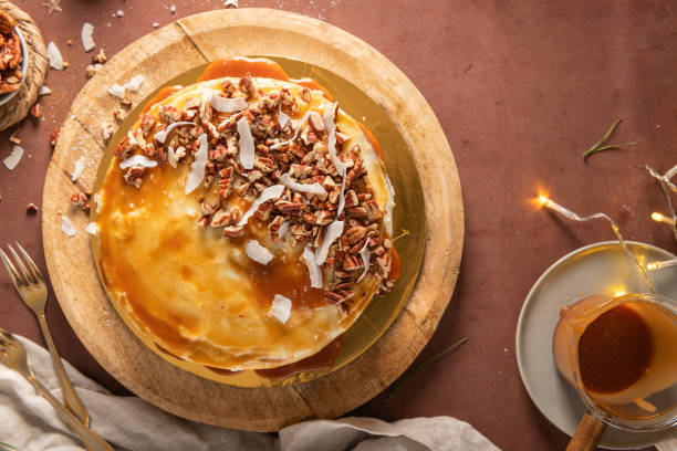 istock Delicious salted caramel cake with pecan nuts and coconut flakes 1930655523